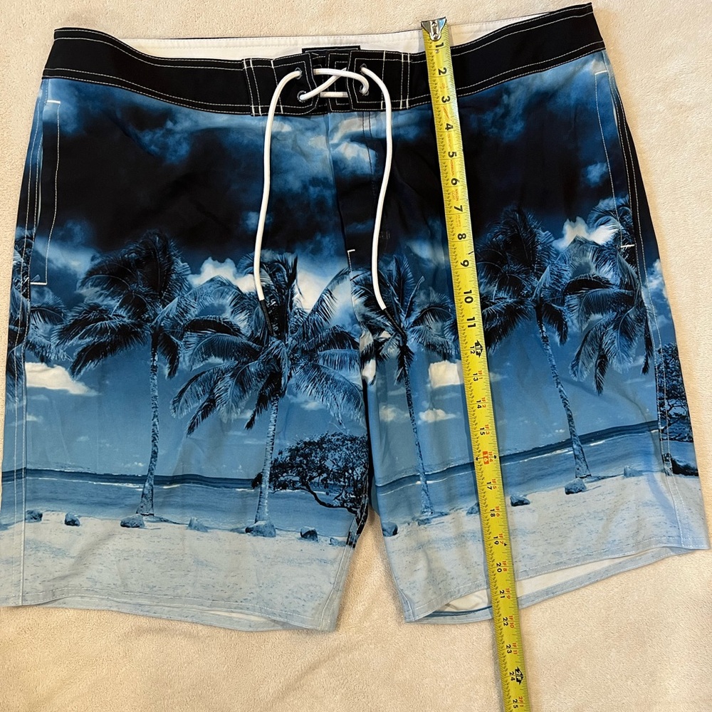 American Eagle XL swim shorts, blue with palm trees.